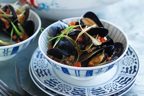 Stir-fried mussels with red bean curd and chillies.