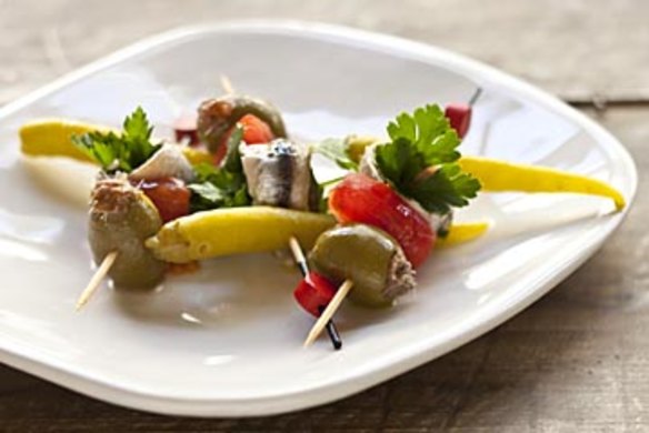 Gilda, skewered white anchovies, guindilla pepper and green olives. Frank Camorra FOOD ON STICKS recipes for Spectrum and Good Food. Photographed by Marina Oliphant. The Sydney Morning Herald. March 8, 2013.