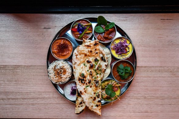 Thali tray of curries,
-Daughter-in-law- Jessi Singh opens his first Melbourne restaurant since 2017. 31st July 2019 The Age News Picture by JOE ARMAO