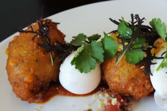 Corn fritters with kasoundi and poached eggs.