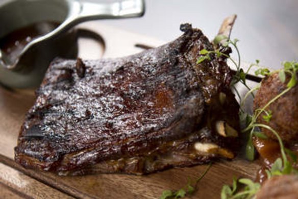 Slow-roasted cola lamb ribs with hush-puppies and peach relish.
