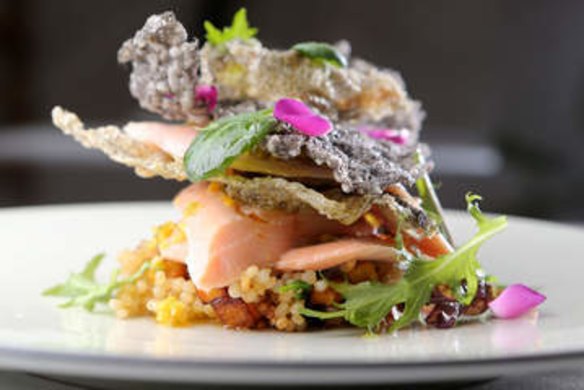 Rainbow trout topped with squid ink rice crisp.