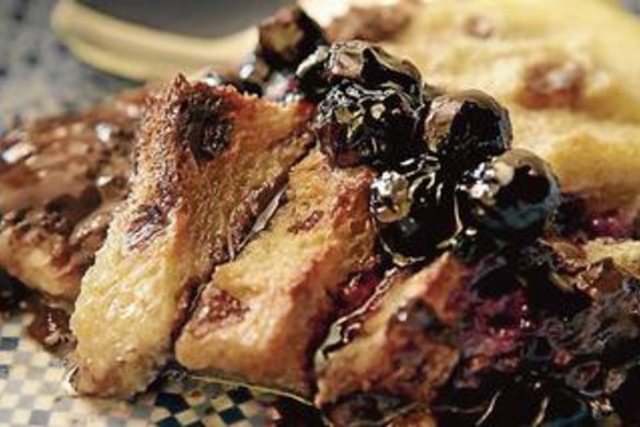 Chocolate bread and butter pudding with blueberry sauce.