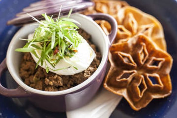 Chinese pretzels with chilli pork mince, spring onions and poached egg.