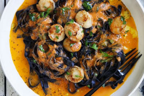 Squid ink pasta with scallops, chilli, tomato and garlic.