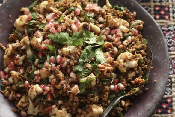 Freekah with cauliflower, pomegranate and mint. Caroline Velik ANCIENT GRAINS recipes for Epicure and Good Living. Photographed by Marina Oliphant. Food preparation and styling by Caroline Velik. Fabric and wooden plates from Manon bis, MUST CREDIT. Photographed March 8, 2012. The Age Newspaper and The Sydney Morning Herald.