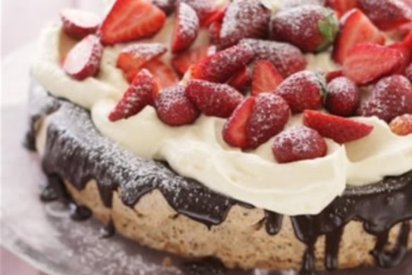 Hazelnut gateau with strawberries and cream