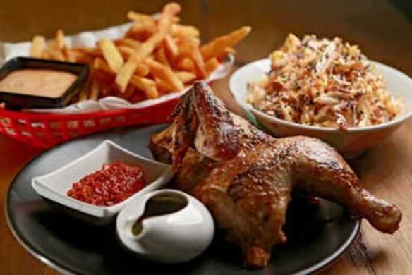 Rotisserie chicken with slaw and fries.