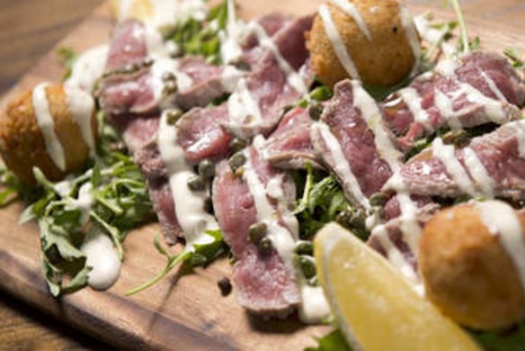 Il Locale's vitello tonnato, poached veal with potato and tuna fritters.