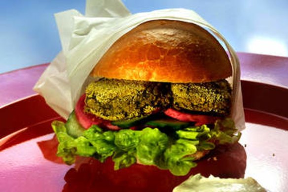 Falafel burger with a dollop of lemony tahini-yoghurt sauce.