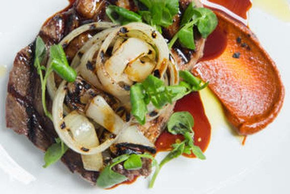 Wagyu bavette serves with charred onion, watercress and harissa at Saint Urban.