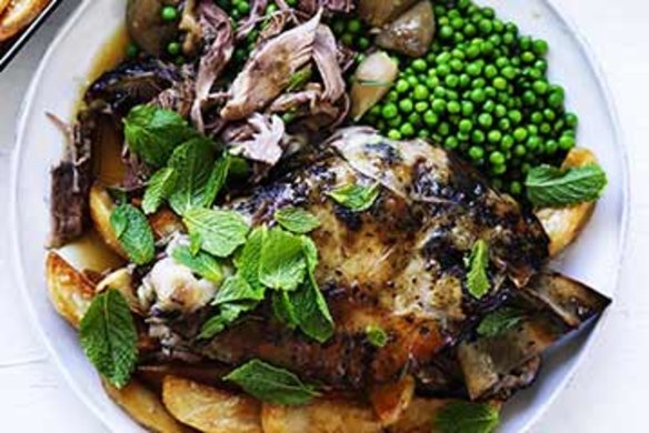 Slow-roasted lamb with tarragon, peas and crispy potatoes.
