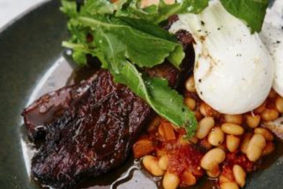 Rich flavour: Brisket slow-cooked in coffee and bourbon with poached eggs and beans.