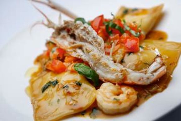 Crab ravioli with prawn, chilli and tomato vinaigrette.