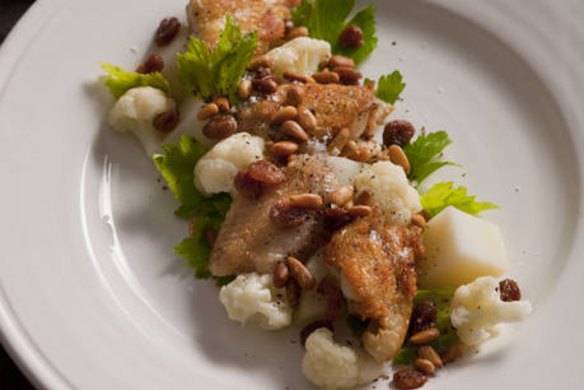Confit chicken wings with cauliflower, sultanas and pinenuts.