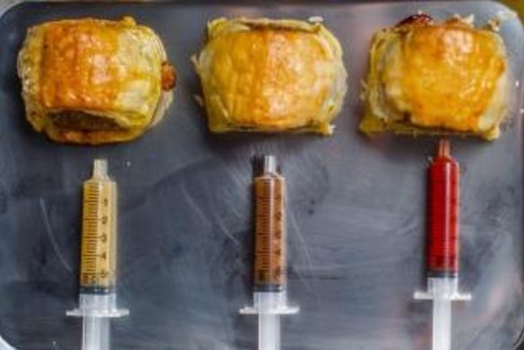 Glamorama's "Phat" sausage rolls with sauce-filled syringes.