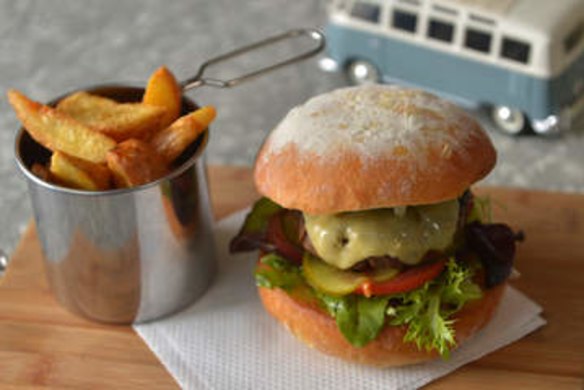 Dakdak burger with hand-cut wedges.