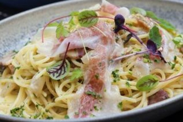 Pasta carbonara and roasted brussels sprouts with smoked almond cream.