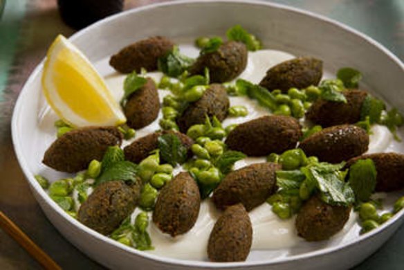 Falafel with broad beans and spice on tahini sauce.