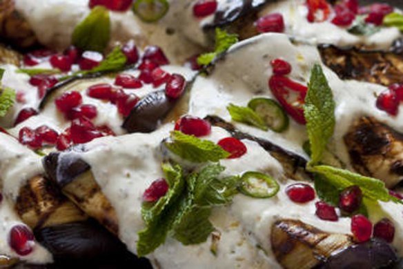 Grilled eggplant with tahini and yoghurt dressing, pomegranate, chilli and mint.
