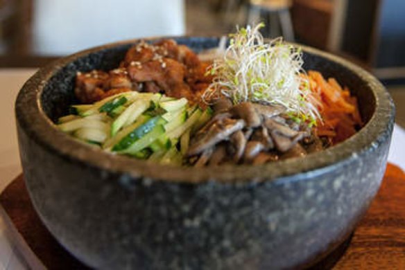 Sizzling: Bibimbap with spicy chicken.
