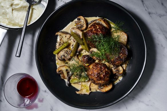 Meatball stroganoff with semolina and cornichons.  