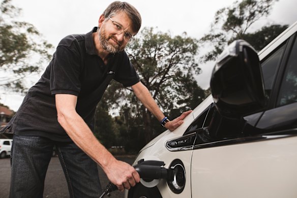Peter Campbell charging his hybrid Holden Volt.