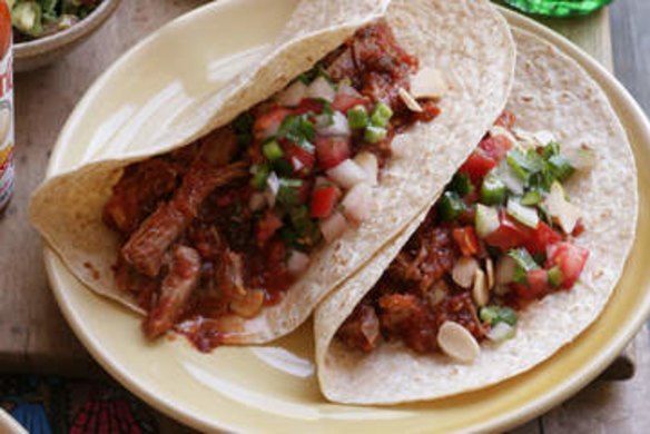 Soft tacos with smoky shredded pork.