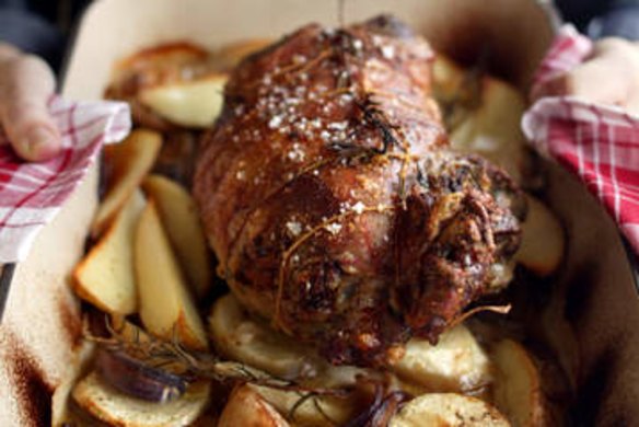 Roast stuffed lamb with parsnip and potatoes.