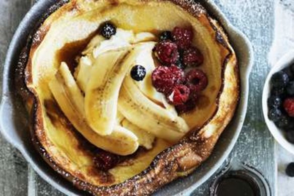 Dutch baby with bananas and berries.