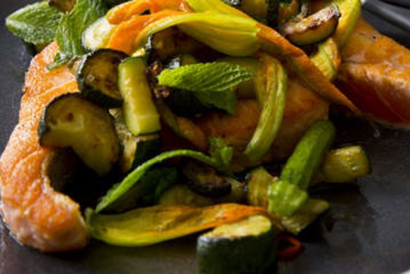 Pan-fried salmon with fried zucchini, zucchini flowers, chilli and mint.