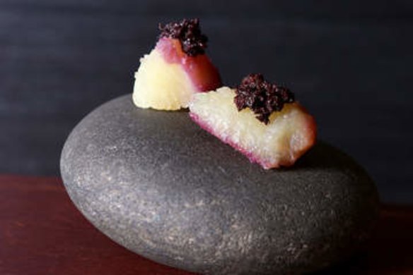 Japanese sweet potato and black olive, served on a rock.