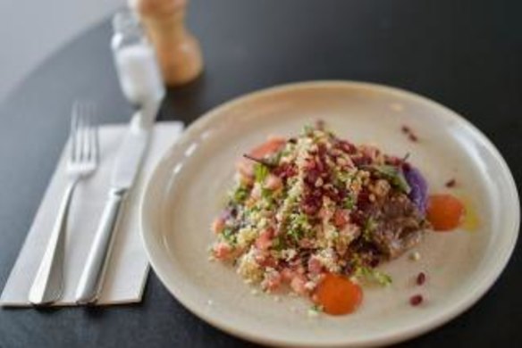The pressed lamb shoulder, purple cabbage, cauliflower tabbouleh, barberries, pine nuts, and harissa.