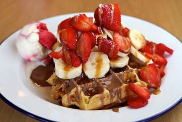 Waffles with strawberries and Belgian couverture chocolate.