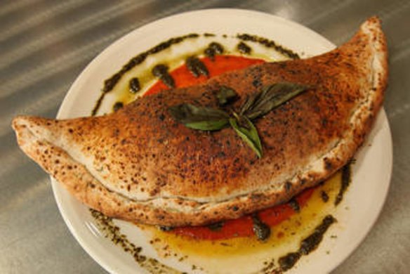 The calzone special served with napoli sauce.