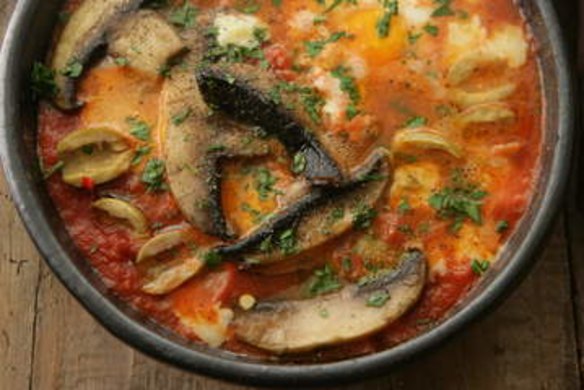 Field mushrooms and eggs in the pan.