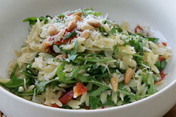 Orzo with rocket, tomato and pine nuts.