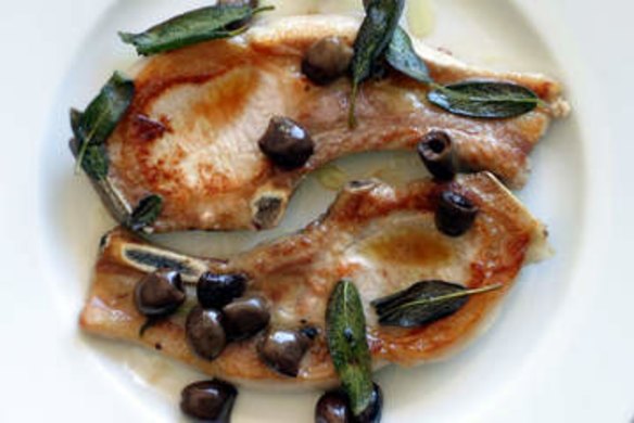 Pan fried pork chops with olives and sage.