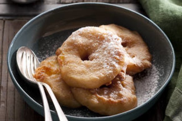 Apple fritters. Caroline Velik APPLE recipes for Epicure and Good Living. Photographed by Marina Oliphant. Food preparation and styling by Caroline Velik. Photographed April 2, 2012. The Age Newspaper and The Sydney Morning Herald.