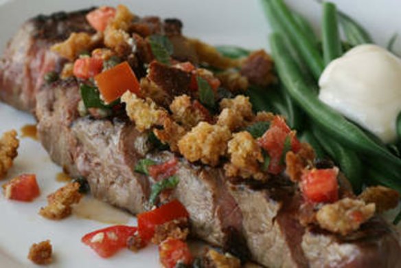 Chargrilled sirloin with crumbed bread, tomato and green beans.