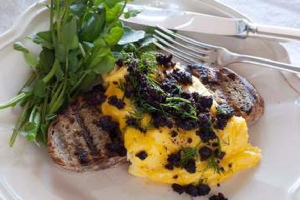 Scrambled eggs with black pudding and watercress.
