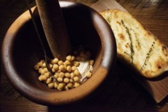 Warm hummus with freshly baked taboon Palestinian bread.