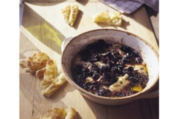 Baked ricotta with grapes, olives and oregano