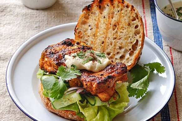 Grilled chicken thigh burger with tahini and chilli relish.