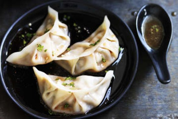 Pork and chive dumplings with red vinegar sauce.