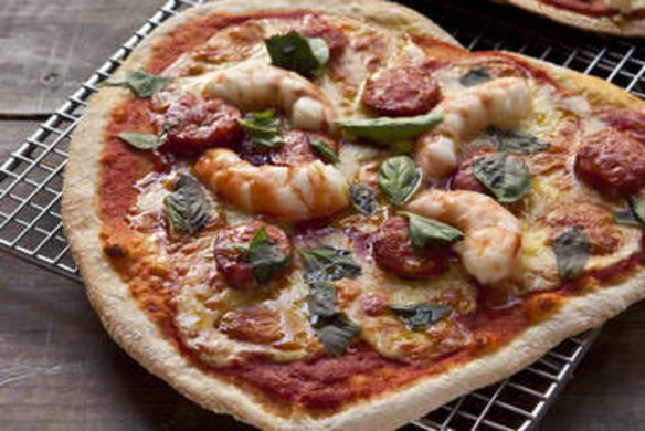 Chorizo and prawn pizza (L) and Zucchini, green olive, mint and feta pizza (R). Frank Camorra PIZZA recipes for Spectrum and Good Food. Photographed by Marina Oliphant. The Sydney Morning Herald. March 8, 2013.