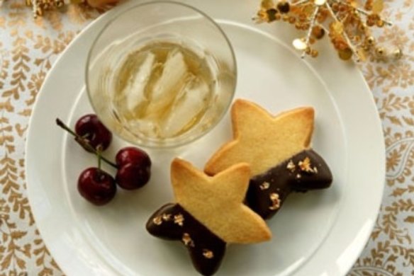 Chocolate amaretto sandwich biscuits with fresh cherries