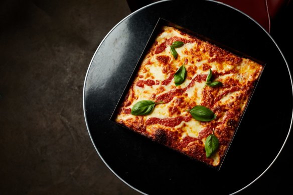 The cheese pizza from Connie's, which measures seven centimetres deep and 30 centimetres on each side.