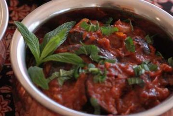 Borani banjan (eggplant and tomato with yoghurt and mint sauce).