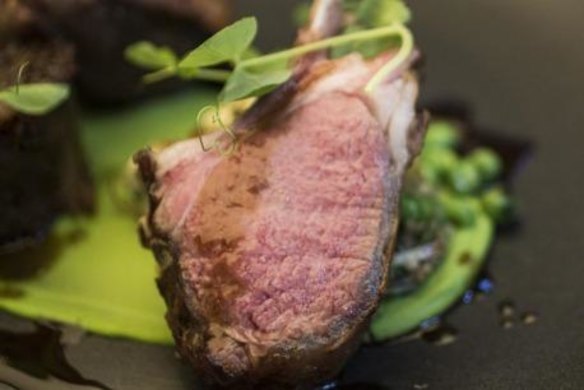 Frenched Cowra double cutlet with a fried croquette of slow-cooked lamb shoulder, green pea puree, mushrooms and veal jus.